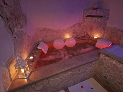 a jacuzzi tub in a room with lights at Suite 800 in Ostuni