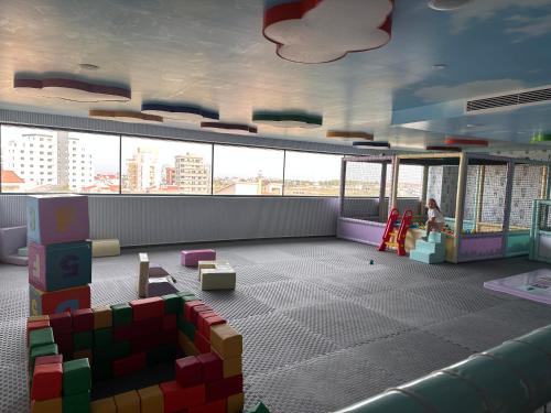 a room with a play area with a child in a building at 2 Bedroom Amazing sea view Grand Sapphire in Iskele
