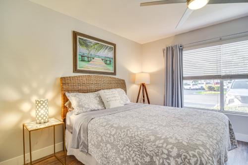 a bedroom with a bed and a window at Modern Isla Del Sol Condo Walk to St Pete Beach! in St Petersburg