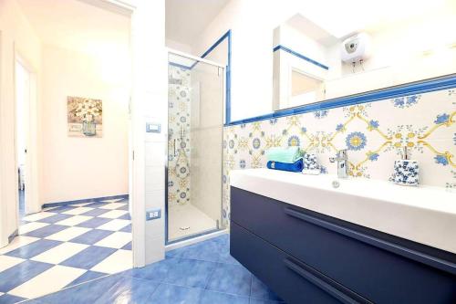 a bathroom with a large sink and a shower at Belvedere Apartments A in Marina di Mancaversa