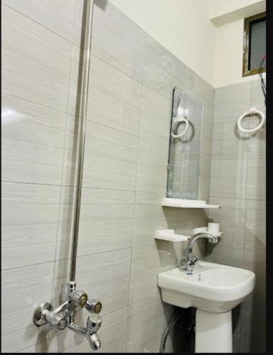 a bathroom with a shower and a toilet and a sink at River Vibes Guest House in Muzaffarabad