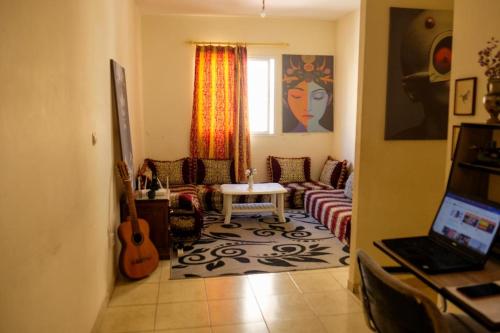a living room with a couch and a table at Room in Agadir Morocco in Agadir