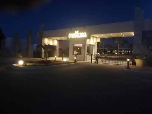 a building with a sign that says cinema at night at Chalet NEMO, vista mare, Sharks Bay, Sharm el Sheikh in Sharm El Sheikh