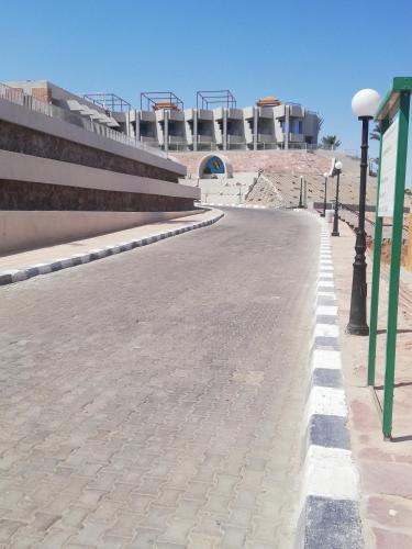 an empty street with a stadium in the background at Chalet NEMO, vista mare, Sharks Bay, Sharm el Sheikh in Sharm El Sheikh