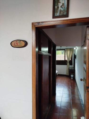 an open door to a room with a hallway at Hotel MAXIRUMA - Villa TAMAUKA in Iza