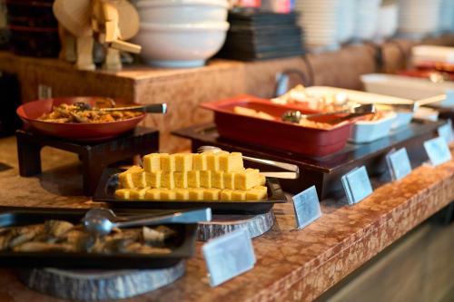 a buffet with different types of food on a counter at Hotel Resol Akihabara in Tokyo