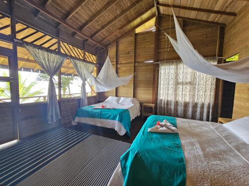 Ένα ή περισσότερα κρεβάτια σε δωμάτιο στο Hotel Piedra Piedra Lodge