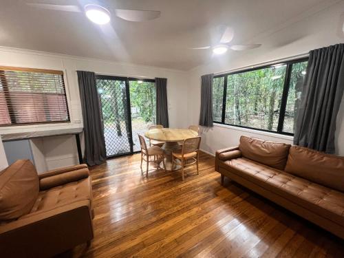 a living room with a couch and a table at Tiona Holiday Park in Tiona