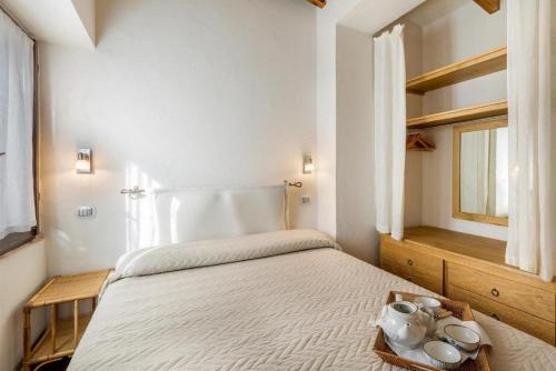 Cama ou camas em um quarto em Villa Itaca - Residence Cala Francese