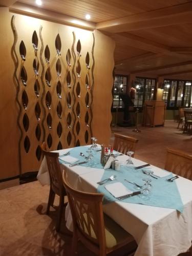 a dining room with a table with a white table cloth at Chalet NEMO, vista mare, Sharks Bay, Sharm el Sheikh in Sharm El Sheikh