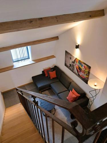a living room with a couch in a loft at B³/ 201 in Bertrix