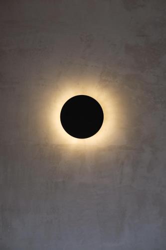 a light fixture on the ceiling of a building at BINDI in Salento