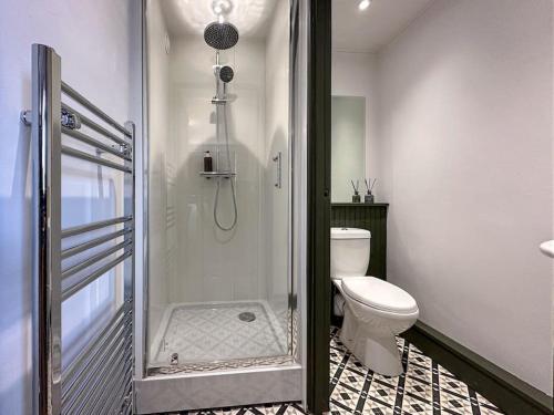 a bathroom with a shower and a toilet in it at The Bunker - Garesfield Golf Course in Newcastle upon Tyne
