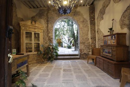 a large room with a large window and a chandelier at Orchid House San Miguel de Allende in San Miguel de Allende