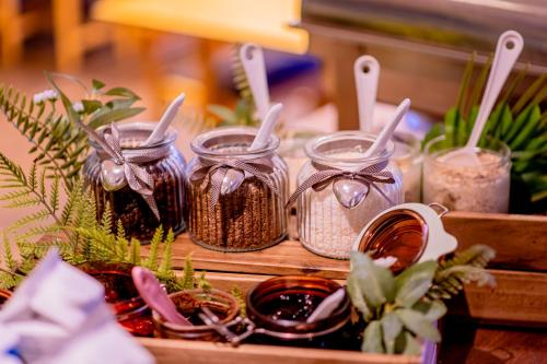 a table with jars of seeds and other plants at Hotel Expo Stockholm in Stockholm