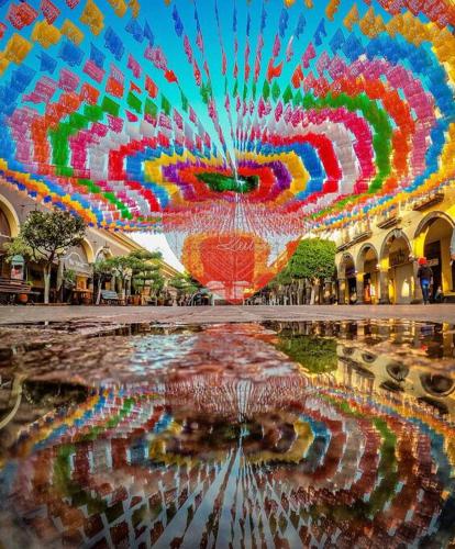 a large room with a reflection in the water at “Encantador Loft” - en el corazón de San Pedro in Guadalajara