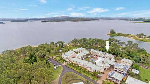 an aerial view of a resort on the water at Haven- Lake Tinaroo Resort in Tinaroo