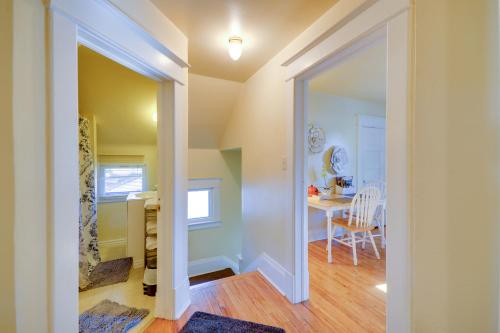 a hallway with a dining room and a kitchen with a table at Cozy Billings Apartment about 1 Mi to Downtown! in Billings
