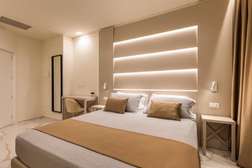 a bedroom with a large bed with two pillows at Bologna Centrale 1 in Bologna