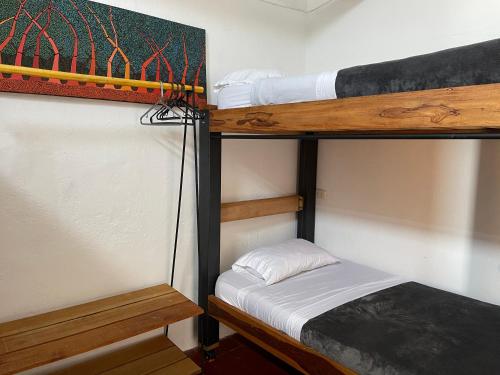 a couple of bunk beds in a room at Popichi Hostel in Villa de Leyva