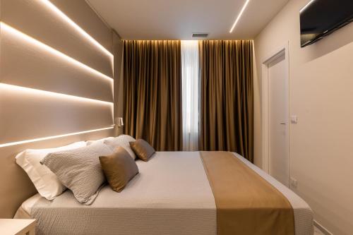 a bedroom with a bed and a window at Bologna Centrale 1 in Bologna