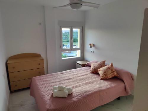 En eller flere senge i et værelse på Apartamento El Rincón del Sur