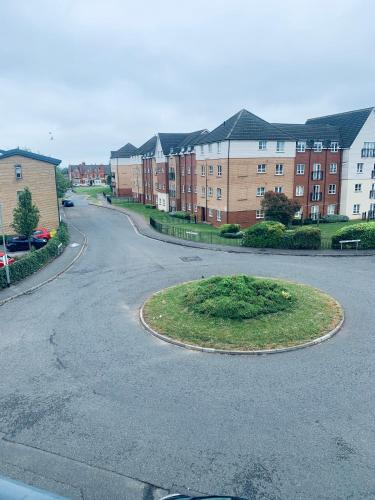 an empty street with a circle in the middle at Riverside Apartment in Northampton