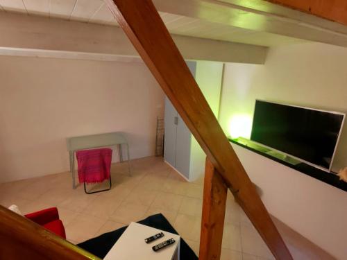 an overhead view of a living room with a flat screen tv at Stefy House in Lastra a Signa
