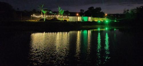 a view of a body of water at night at Vila Eco Mobili in São Roque