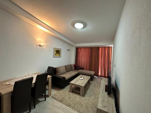 a living room with a couch and a table at Apartment OLD BAZAR in Ulcinj