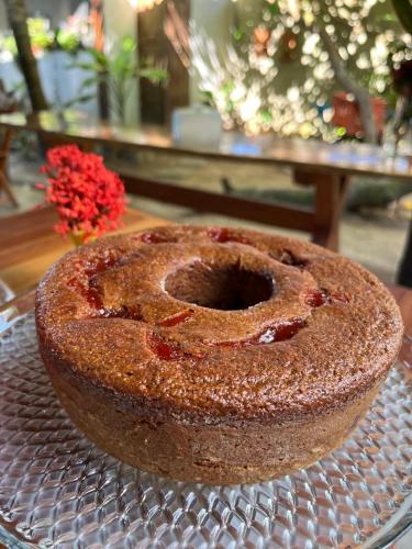 a bundt cake sitting on a plate on a table at Pousada Águas de Tamandaré in Tamandaré