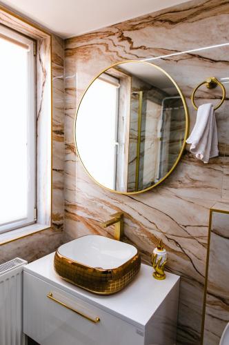 a bathroom with a toilet and a mirror at Modern Lux Apartment 3 in Brčko