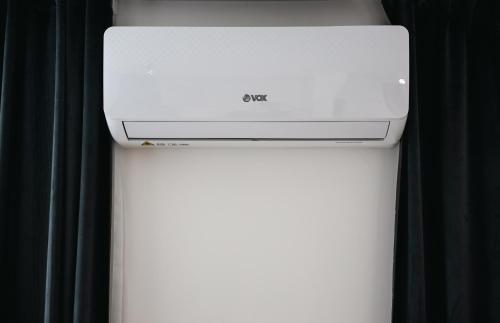 a white computer printer sitting on top of a table at Modern Lux Apartment 3 in Brčko