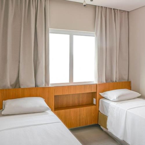 Ένα ή περισσότερα κρεβάτια σε δωμάτιο στο Premium ou Exclusive Resort de 2 quartos - WA