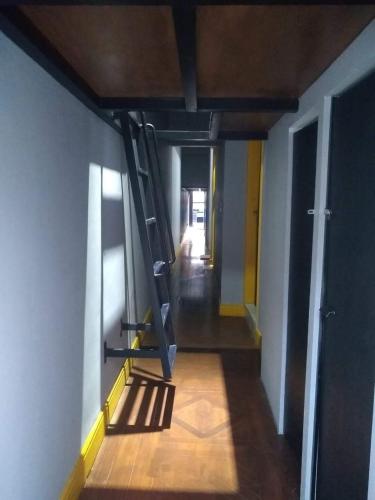 a room with a ladder on the side of a wall at Gran Village Hostel in Sao Paulo