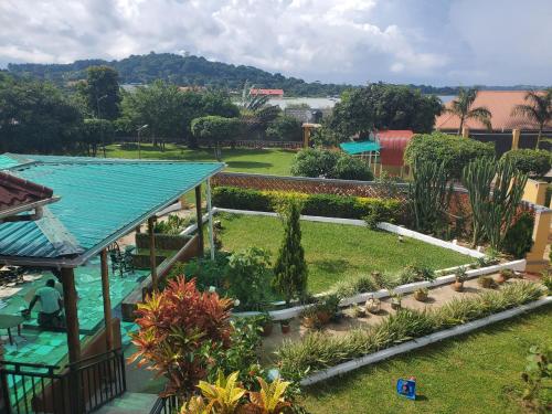 an aerial view of a garden with a swimming pool at Alice Gardens & Campsite in Entebbe