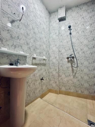a bathroom with a shower and a sink at Aourir soul hostel in Aourir