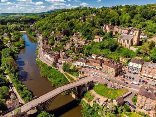 an aerial view of a town with a bridge over a river at Shropshire Guesthouse in Wolverhampton