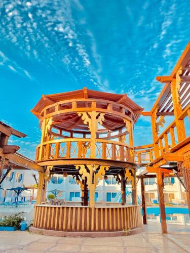 a large wooden structure with a wooden deck at Regency Hotel in Sharm El Sheikh