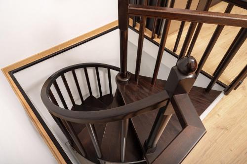 a wooden chair sitting on top of a staircase at Endless Blue in Pythagoreio