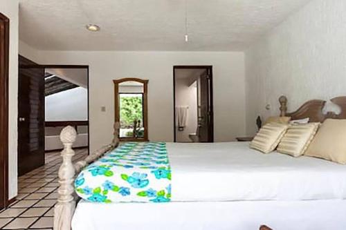 מיטה או מיטות בחדר ב-Cancún Villa Boreal