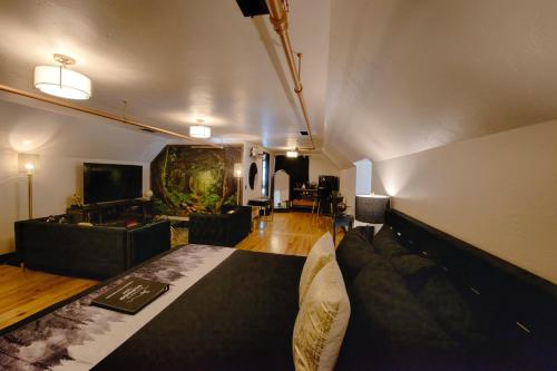 a living room with a couch and a tv at Historic Tapoco Lodge Resort in Tapoco