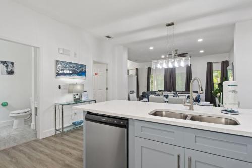 a kitchen with a sink and a counter top at Allure - Sleeps 8 - 3 BDM - Disney in Kissimmee