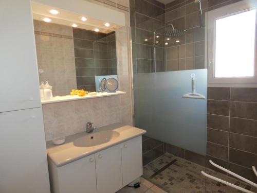 a bathroom with a sink and a mirror at Maison lumineuse avec jardin - 4 personnes - FR-1-540-286 in Notre-Dame-de-Monts