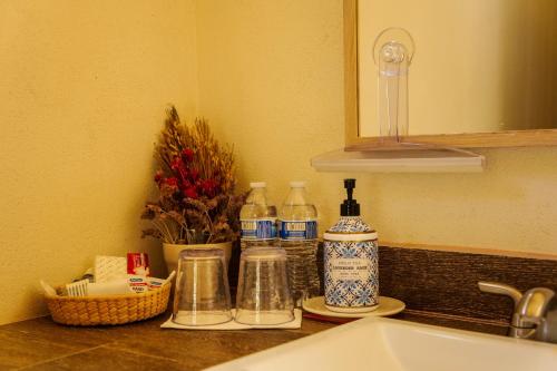 a bathroom counter with a sink and a mirror at Quinta Estrella in Valle de Guadalupe
