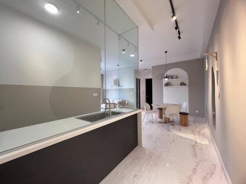 a kitchen with a sink and a dining room at Setia Sky 88 by Cactus Homestay THM in Johor Bahru