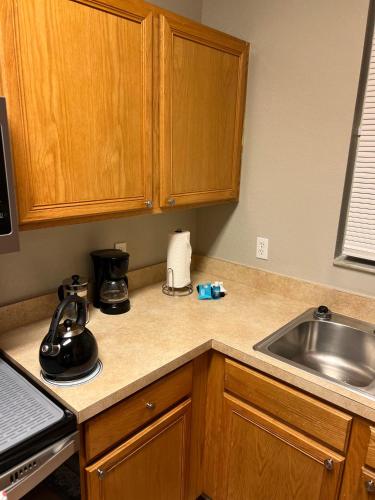 a kitchen with a sink and a counter top at Vashay's Lovely vacation pad at Disney in Davenport