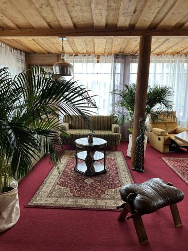 a living room with a couch and a table at Rakši in Cēsis
