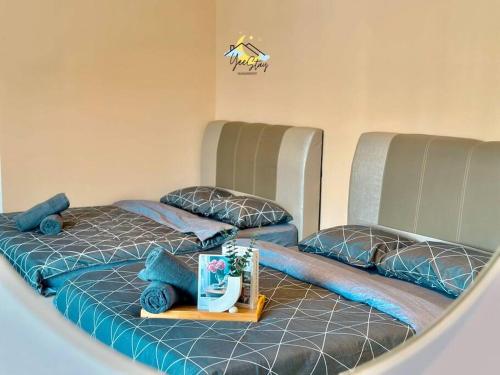Una cama o camas en una habitación de BukitKatil16pax-snooker｜arcade