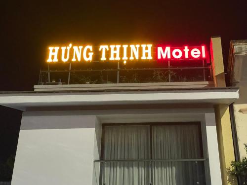 a neon sign on the top of a building at Hưng Thịnh Motel in Dong Hoi